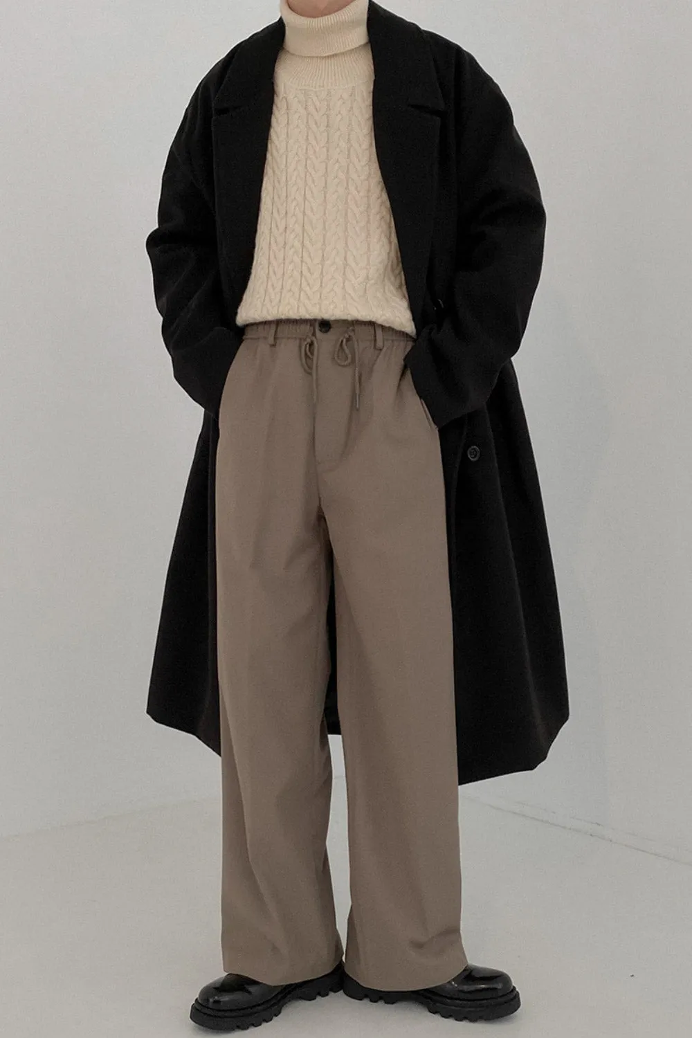 Double-breasted mid-length woolen coat
