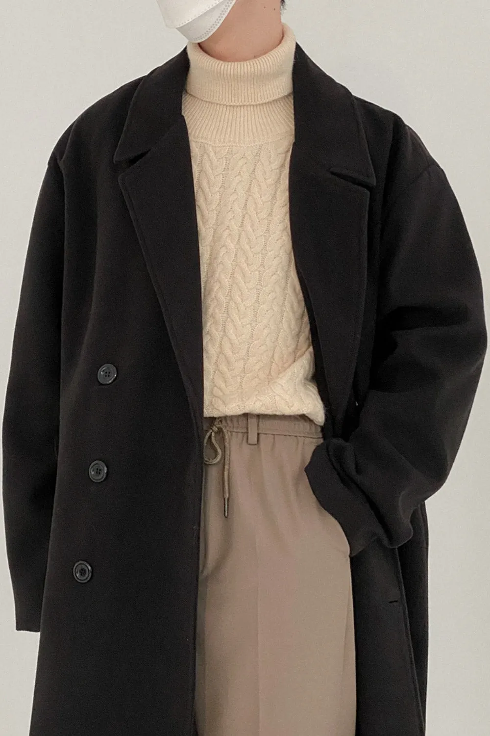 Double-breasted mid-length woolen coat