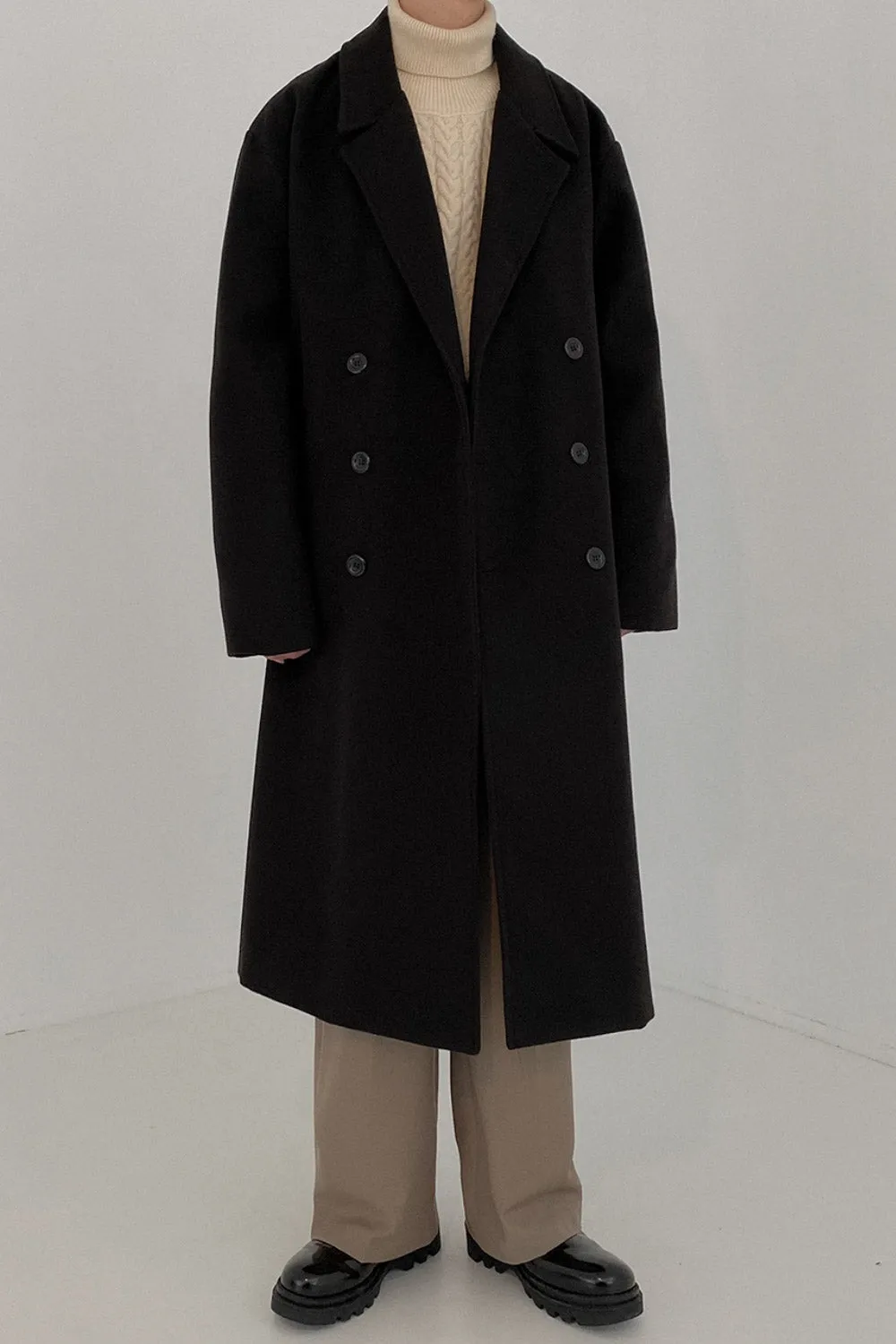 Double-breasted mid-length woolen coat