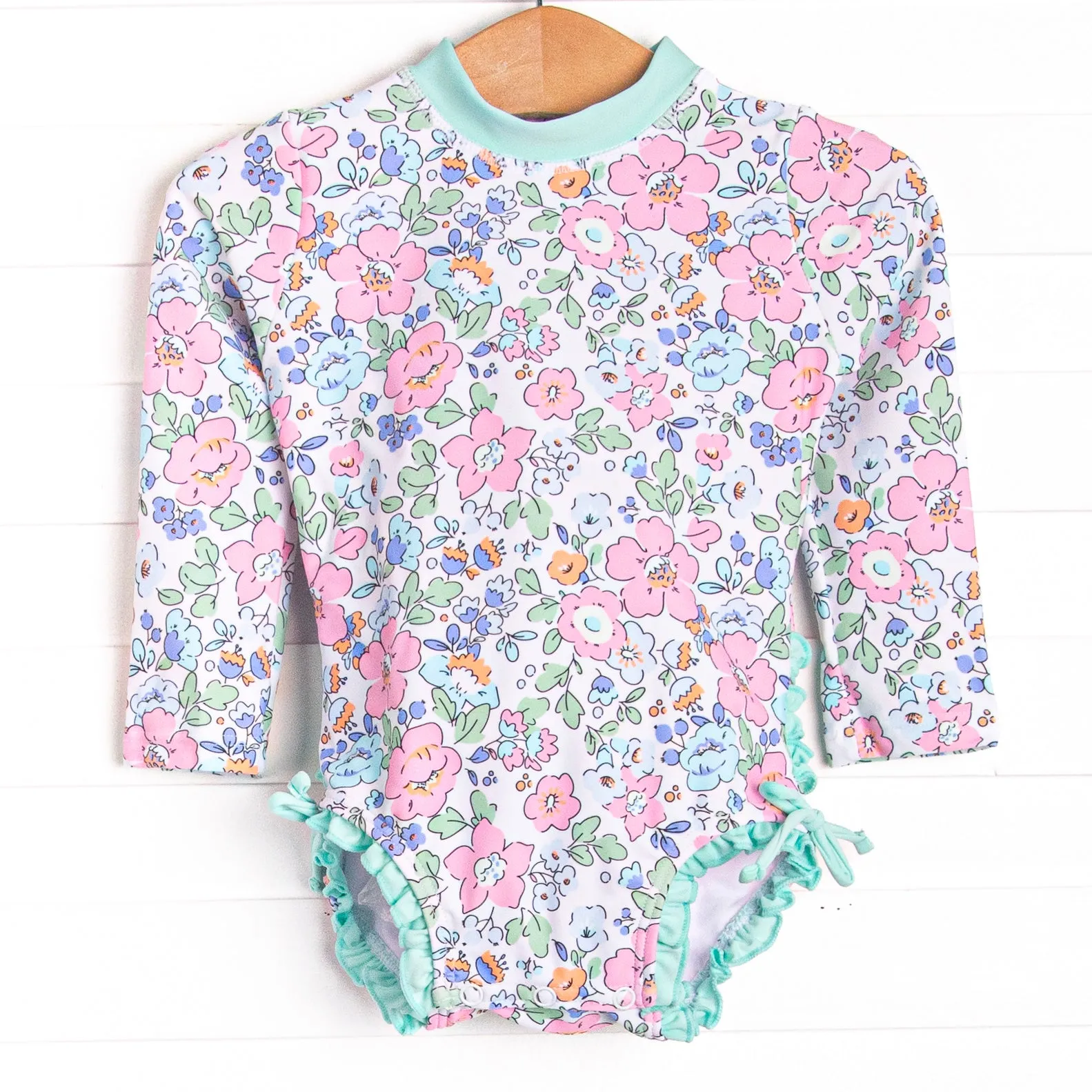Pink Magnolia Long Sleeve One Piece Rash Guard, Blue